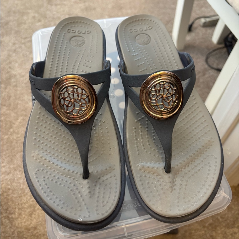 CROCS Gray Thong Sandals with Gold Medallion